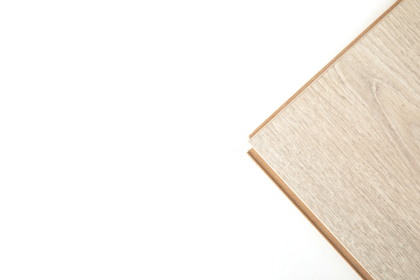 Two wood-grain laminate flooring planks on a white background.